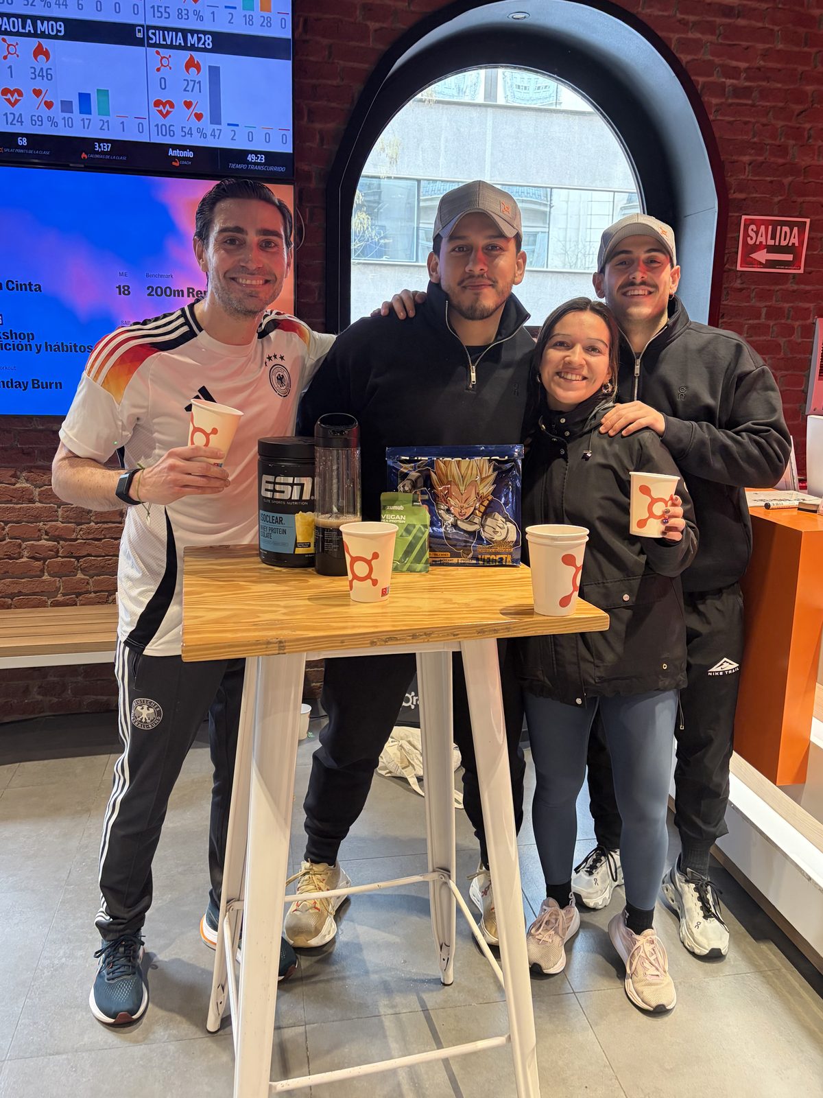 Daniel Escobar with the Orangetheory Fitness Velázquez coaches during the pre-launch tasting session.